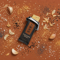 SVRY Everything Bagel Protein Bar on a surface with spices and seasonings
