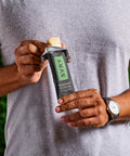 Person holding a rosemary olive oil SVRY protein bar