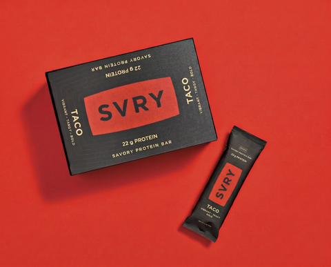 SVRY savory protein bar packaging on a red background